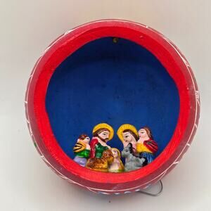 handcrafted Peruvian folk art gourd diorama featuring a painted nativity scene
